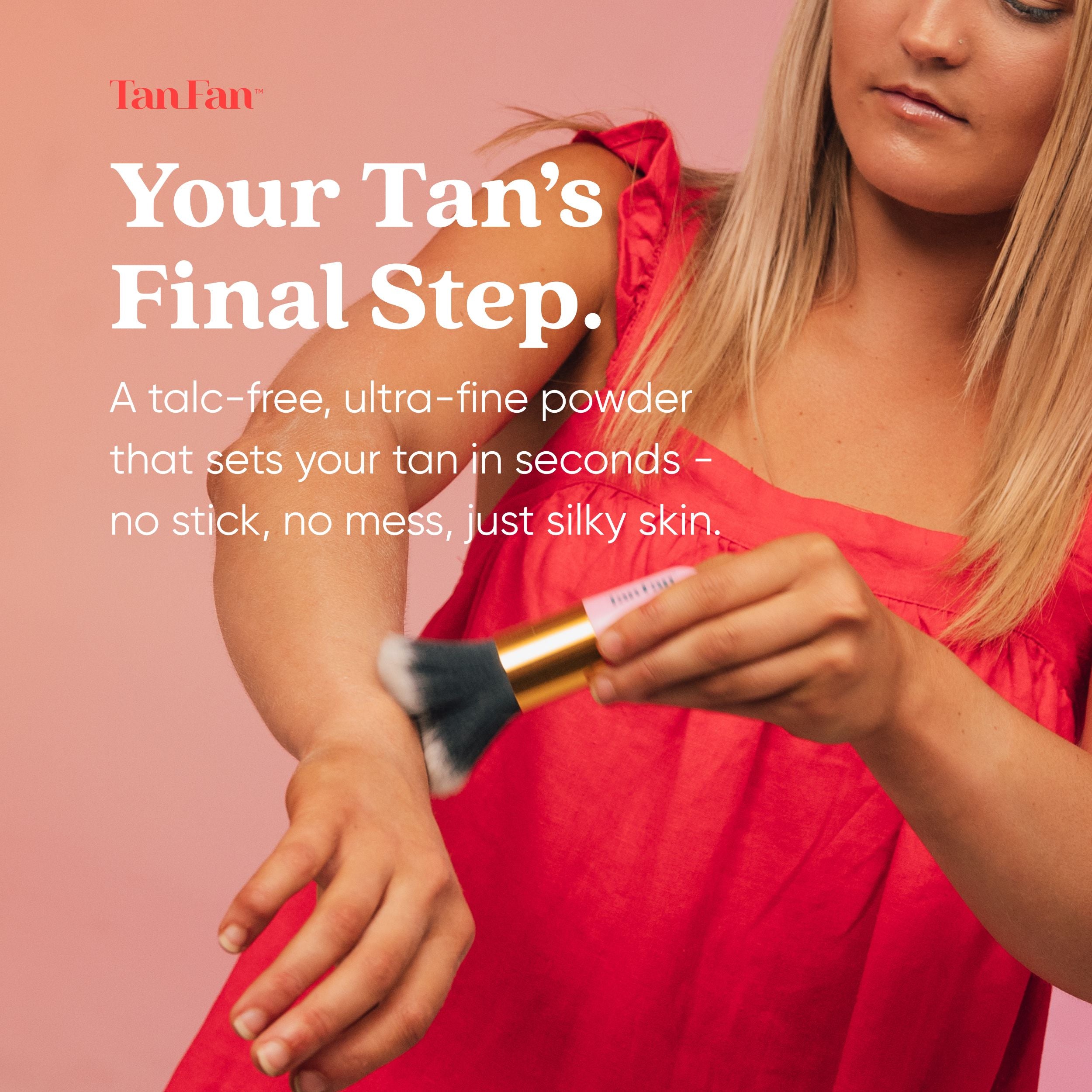 Woman applying tan powder with a brush on a pink background, featuring Tan Fan product.