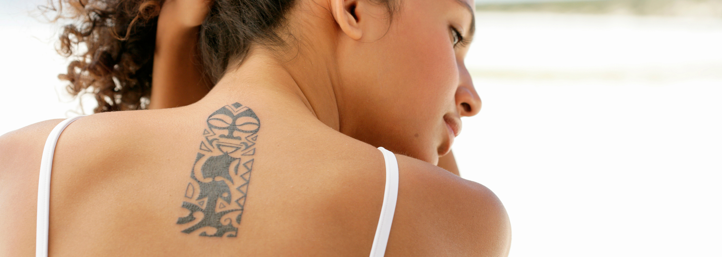 Tanning and Tattoos: How to Apply Self-Tanner Without Affecting Your Ink